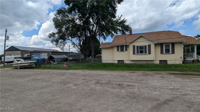 1549 Quimby Ave SW, Canton, OH 44706 - view of property exterior with a chimney