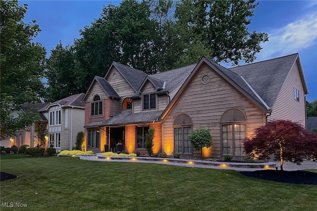 5502 Quail Run, North Olmsted, OH 44070 - view of front of house featuring a front lawn and a shingled roof