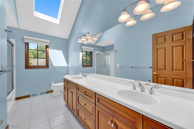 5502 Quail Run, North Olmsted, OH 44070 - full bathroom featuring a skylight, double vanity, plenty of natural light, high vaulted ceiling, and tile patterned flooring