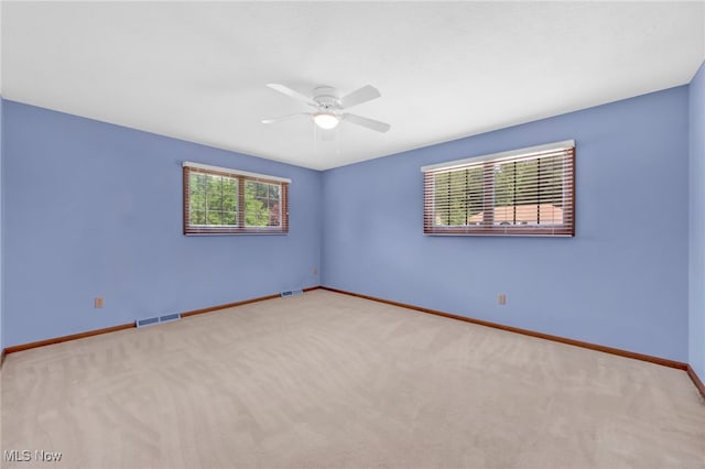 5502 Quail Run, North Olmsted, OH 44070 - carpeted empty room with a ceiling fan and baseboards