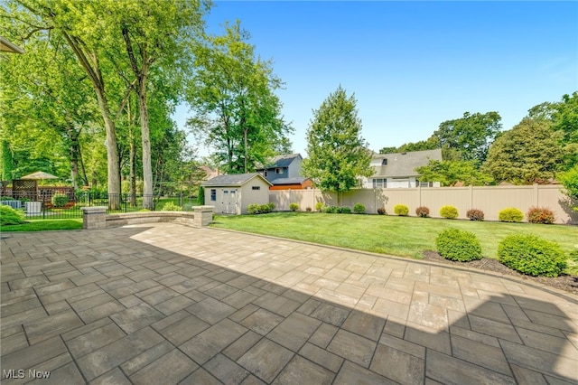 5502 Quail Run, North Olmsted, OH 44070 - fenced backyard featuring a patio and a storage shed