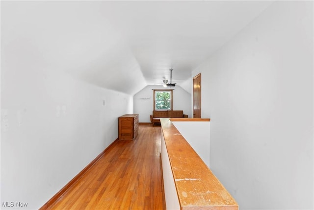 302 Bender Ave, Akron, OH 44312 - corridor with lofted ceiling, light wood-style floors, and an upstairs landing