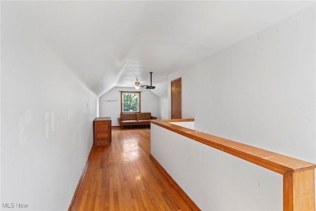 302 Bender Ave, Akron, OH 44312 - hall with light wood-style flooring, vaulted ceiling, and an upstairs landing