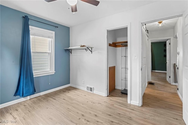 302 Bender Ave, Akron, OH 44312 - unfurnished bedroom with light wood-style floors, a ceiling fan, and a closet