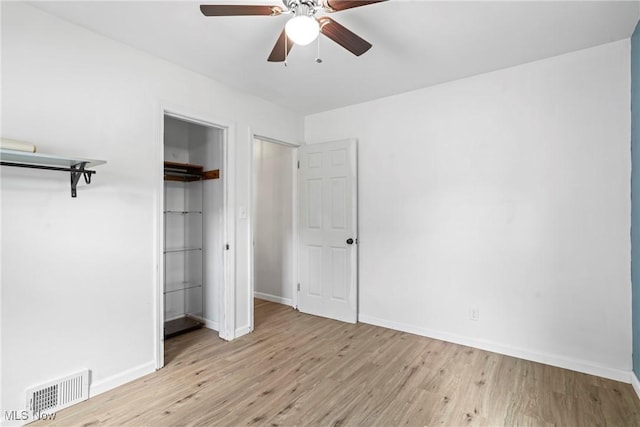 302 Bender Ave, Akron, OH 44312 - unfurnished bedroom featuring wood finished floors, a closet, and a ceiling fan