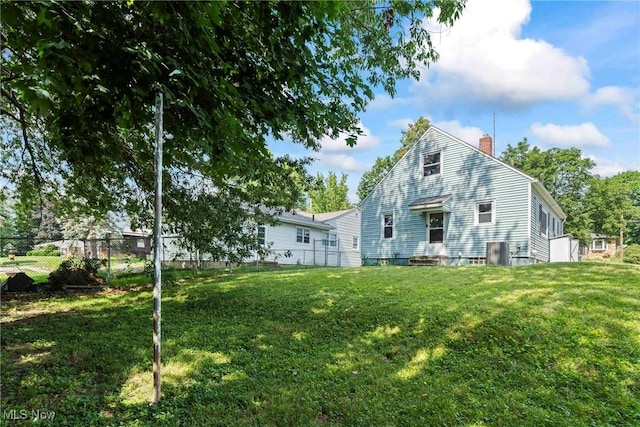 302 Bender Ave, Akron, OH 44312 - rear view of house featuring a chimney