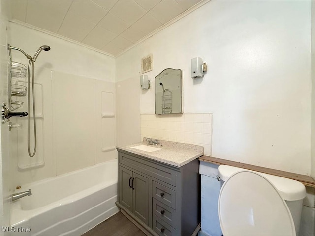 5048 Grove Ave, Lorain, OH 44055 - full bathroom featuring vanity, bathtub / shower combination, backsplash, and crown molding