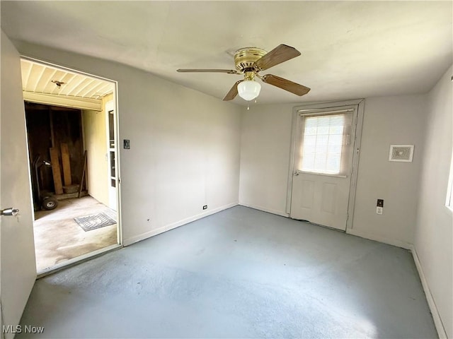 5048 Grove Ave, Lorain, OH 44055 - spare room with concrete floors and a ceiling fan