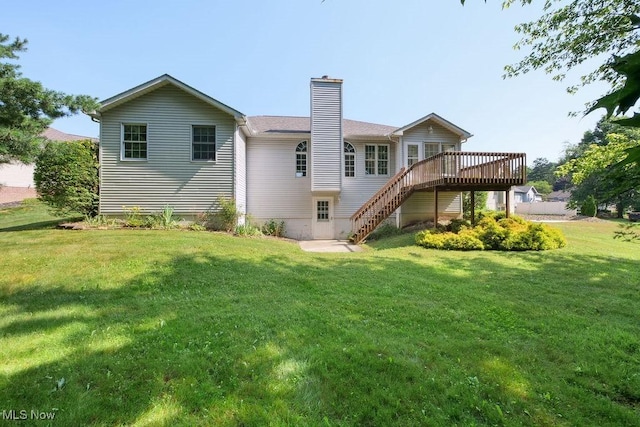 215 Bailey Ct, Doylestown, OH 44230 - back of house featuring a deck, a chimney, stairway, and a lawn