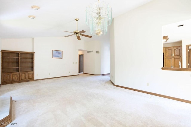 215 Bailey Ct, Doylestown, OH 44230 - unfurnished living room featuring light colored carpet, a ceiling fan, a chandelier, and high vaulted ceiling