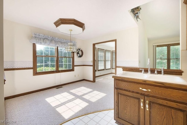 215 Bailey Ct, Doylestown, OH 44230 - bathroom featuring healthy amount of natural light and a chandelier