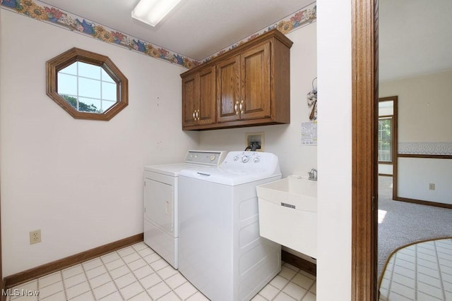 215 Bailey Ct, Doylestown, OH 44230 - laundry room featuring washing machine and dryer, plenty of natural light, and cabinet space