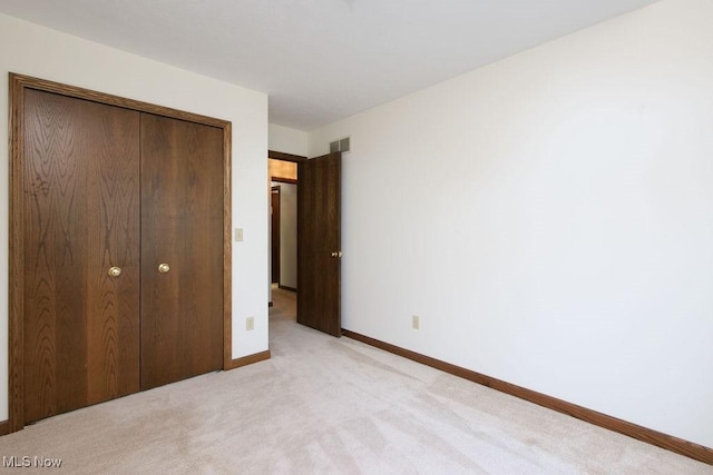215 Bailey Ct, Doylestown, OH 44230 - unfurnished bedroom featuring a closet and light colored carpet