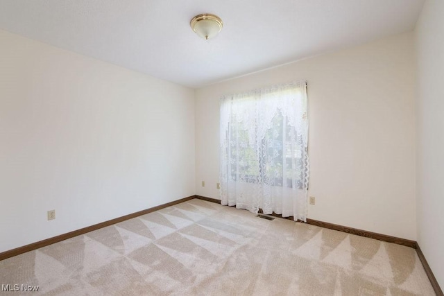 215 Bailey Ct, Doylestown, OH 44230 - spare room with light carpet and baseboards