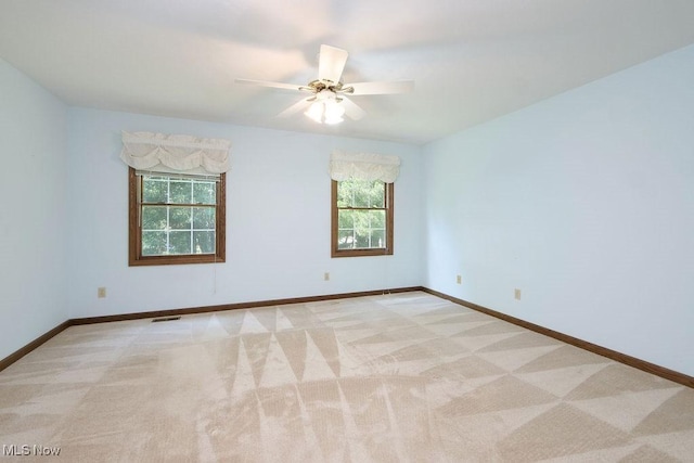 215 Bailey Ct, Doylestown, OH 44230 - empty room featuring light colored carpet and a ceiling fan