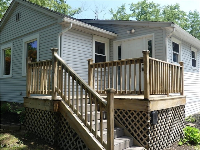 6069 Hyde St, Mentor, OH 44060 - wooden deck featuring stairs
