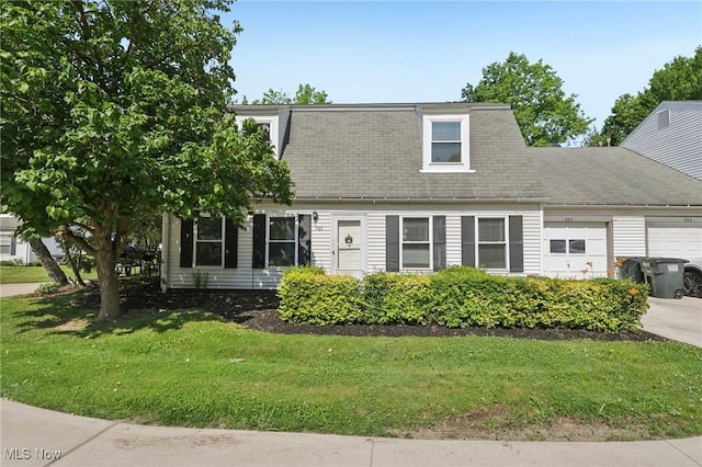 8080 Harbor Crk Unit 503, Mentor On The Lake, OH 44060 - view of front facade featuring an attached garage, a front lawn, driveway, and a shingled roof