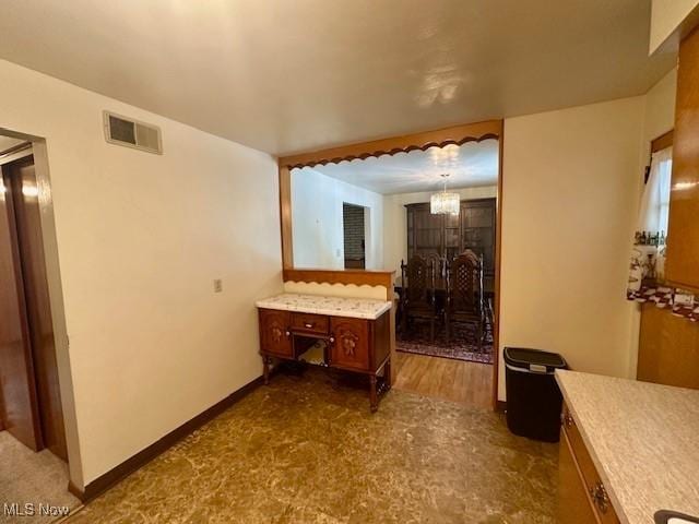 211 Donnell St, Weirton, WV 26062 - bathroom featuring a chandelier and baseboards