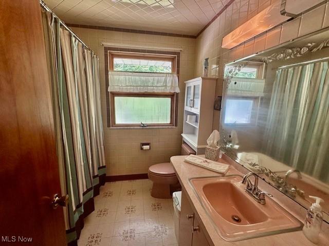 211 Donnell St, Weirton, WV 26062 - bathroom with vanity and a shower with shower curtain