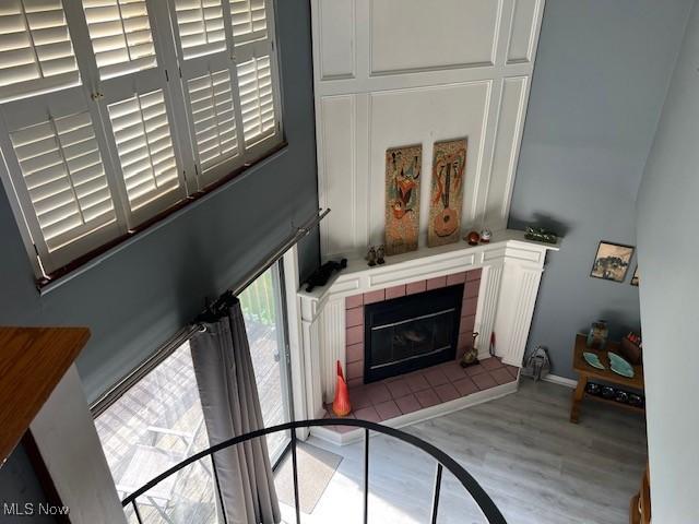 2157 Penguin Ave, Akron, OH 44319 - living room featuring a tiled fireplace and wood finished floors