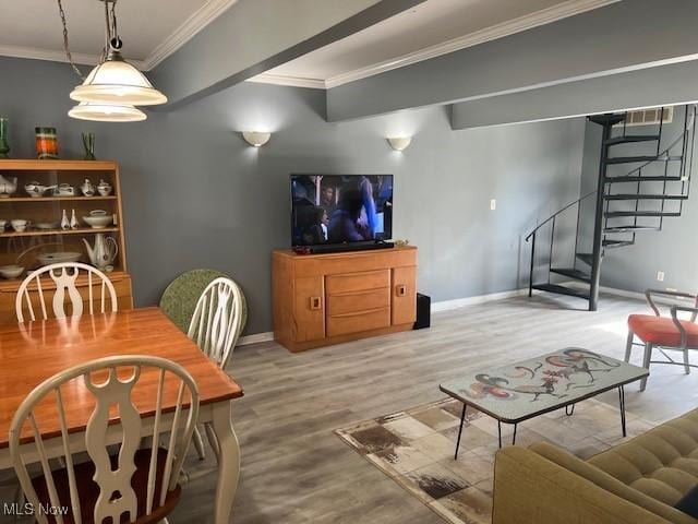 2157 Penguin Ave, Akron, OH 44319 - dining room featuring crown molding, wood finished floors, and stairs