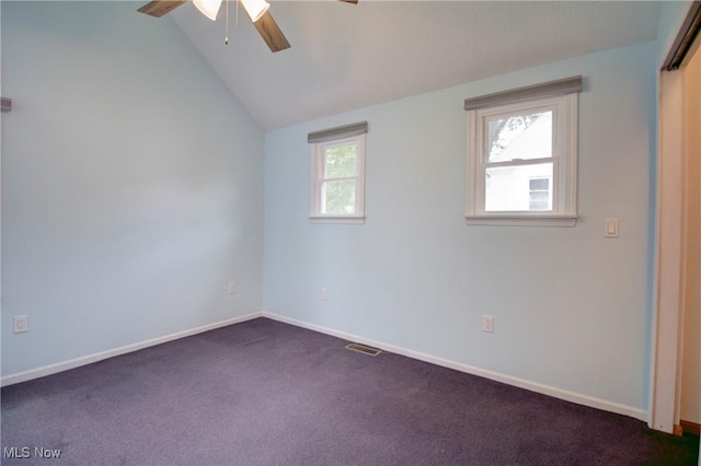 181 Seminary St, Berea, OH 44017 - spare room featuring ceiling fan, dark colored carpet, and vaulted ceiling