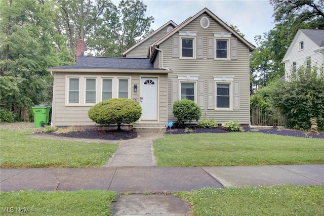 181 Seminary St, Berea, OH 44017 - view of front facade with entry steps, a chimney, and a front yard