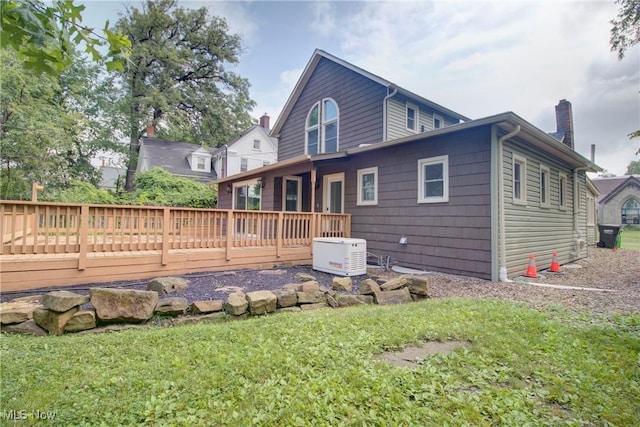 181 Seminary St, Berea, OH 44017 - rear view of property with a wooden deck, a chimney, and a lawn