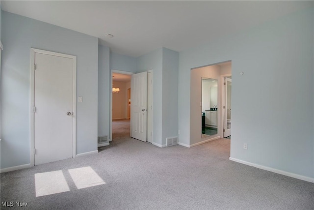 181 Seminary St, Berea, OH 44017 - unfurnished bedroom featuring carpet floors and a chandelier
