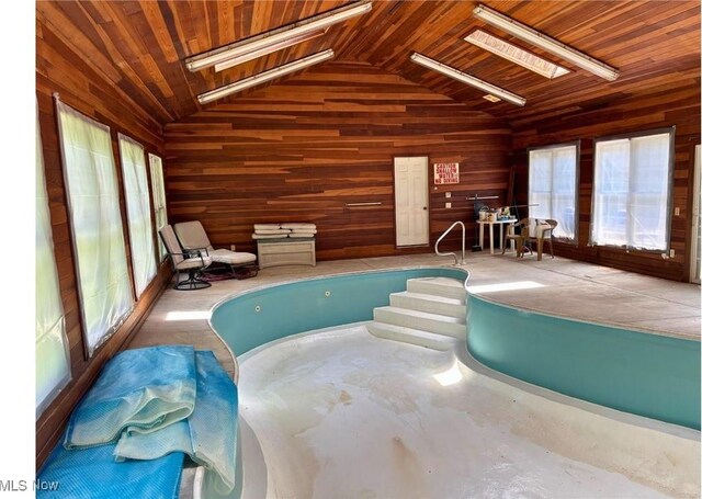 611 Wainwright Rd SE, New Philadelphia, OH 44663 - view of swimming pool featuring a hot tub and a skylight