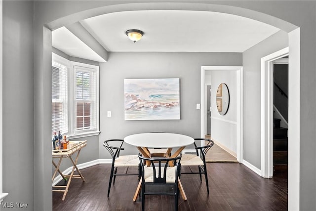 2324 Scholl Rd, University Heights, OH 44118 - dining area with dark wood-type flooring and arched walkways