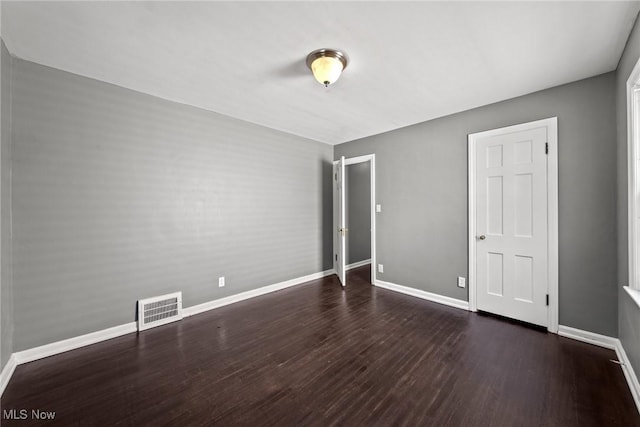 2324 Scholl Rd, University Heights, OH 44118 - unfurnished bedroom with baseboards and wood finished floors