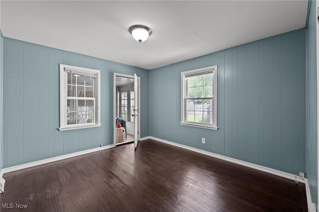 2324 Scholl Rd, University Heights, OH 44118 - spare room with dark wood finished floors and baseboards