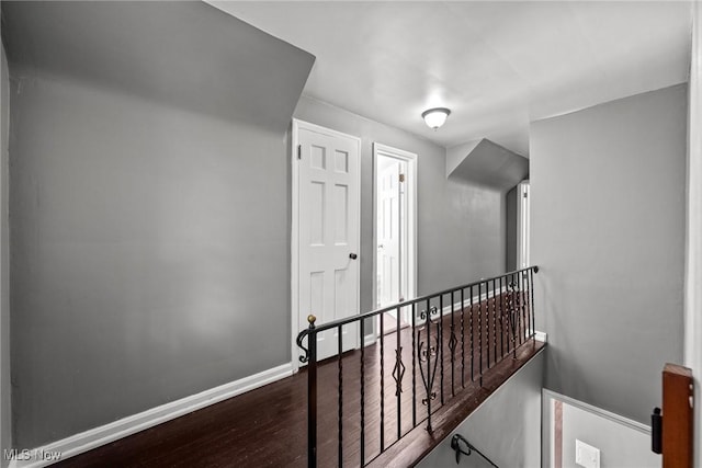 2324 Scholl Rd, University Heights, OH 44118 - hall featuring an upstairs landing and wood finished floors