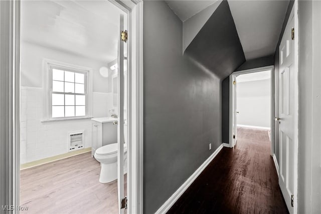 2324 Scholl Rd, University Heights, OH 44118 - hallway featuring wood finished floors, wainscoting, and tile walls