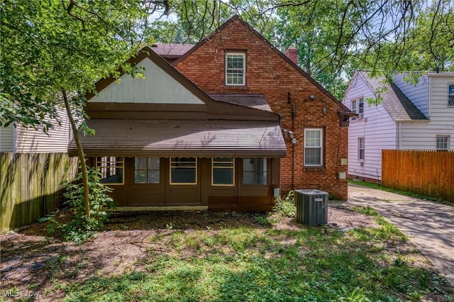 2324 Scholl Rd, University Heights, OH 44118 - rear view of house featuring a chimney and brick siding