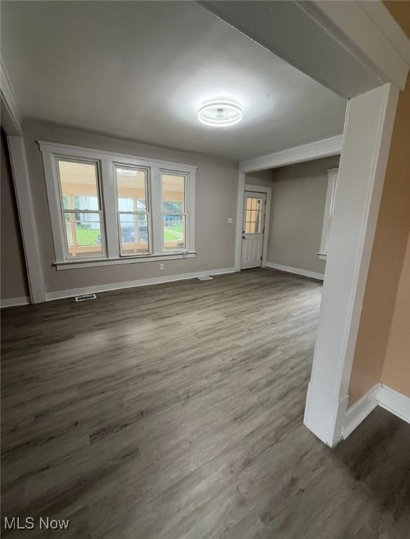 1063 Raymond St, Akron, OH 44307 - unfurnished living room with wood finished floors
