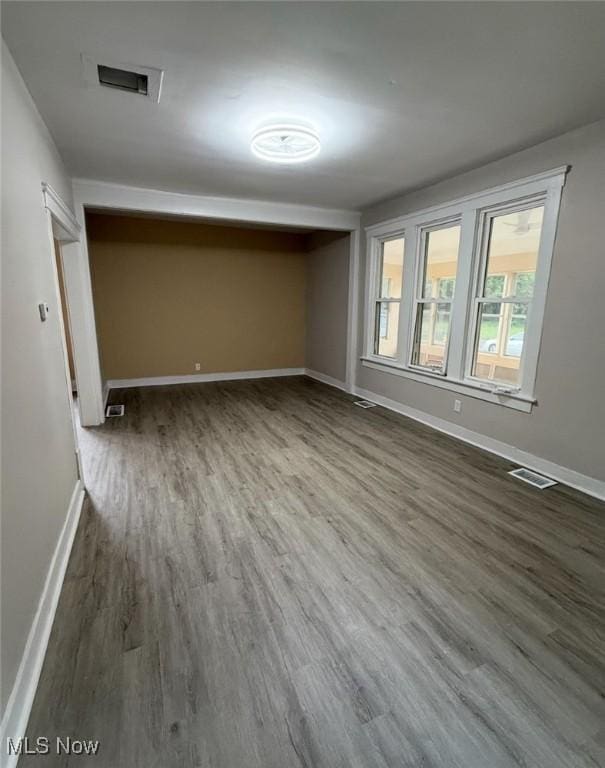 1063 Raymond St, Akron, OH 44307 - empty room with wood finished floors and baseboards
