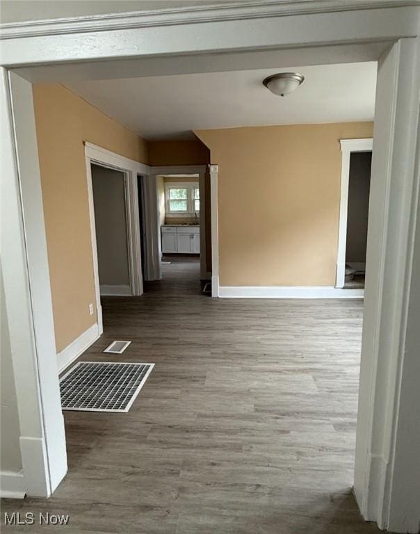 1063 Raymond St, Akron, OH 44307 - hall with baseboards and wood finished floors