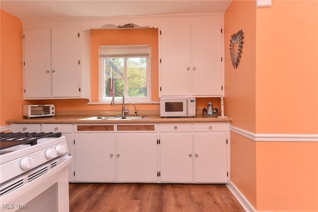 1212 State Route 7 NE, Brookfield, OH 44403 - kitchen with white appliances, light wood-style flooring, white cabinets, and light countertops