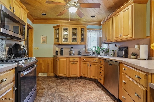2970 Meadow Ln, Youngstown, OH 44511 - kitchen featuring appliances with stainless steel finishes, wood ceiling, wainscoting, light countertops, and a ceiling fan