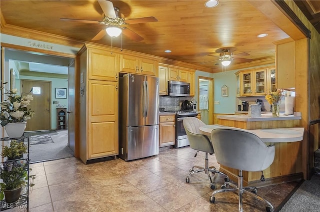 2970 Meadow Ln, Youngstown, OH 44511 - kitchen featuring stainless steel appliances, a ceiling fan, glass insert cabinets, a peninsula, and ornamental molding