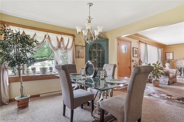 2970 Meadow Ln, Youngstown, OH 44511 - carpeted dining room with a chandelier and baseboard heating