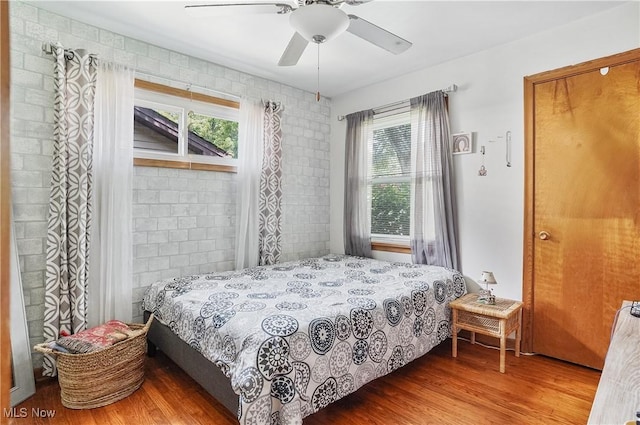 2970 Meadow Ln, Youngstown, OH 44511 - bedroom with multiple windows, wood finished floors, and ceiling fan