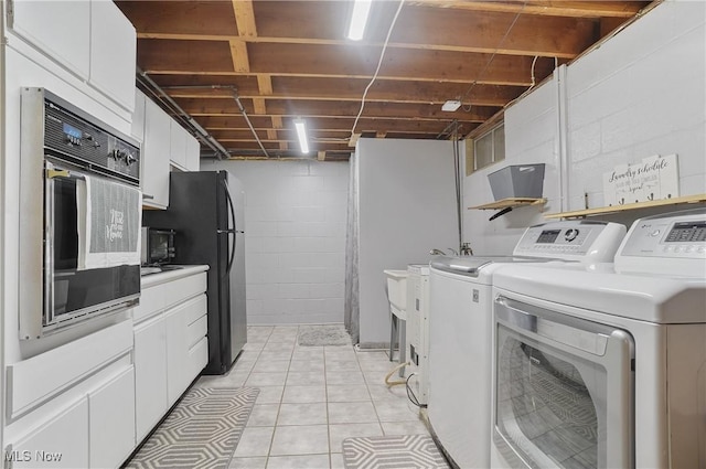 2970 Meadow Ln, Youngstown, OH 44511 - washroom featuring washing machine and dryer and light tile patterned floors