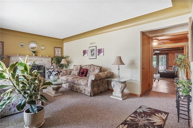 2970 Meadow Ln, Youngstown, OH 44511 - living room with carpet, a brick fireplace, and a ceiling fan