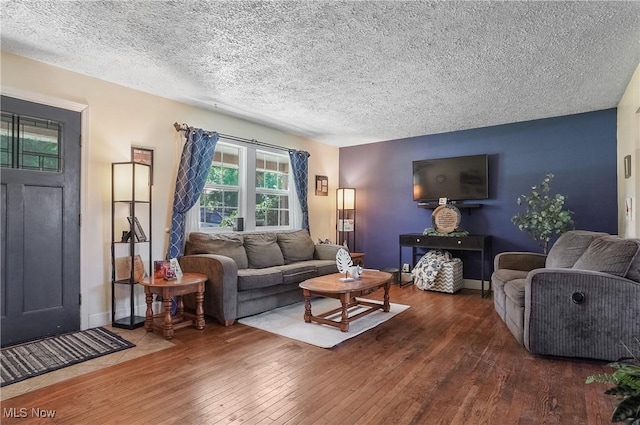 13774 Smith Goshen Rd, Beloit, OH 44609 - living room with hardwood / wood-style floors and a textured ceiling