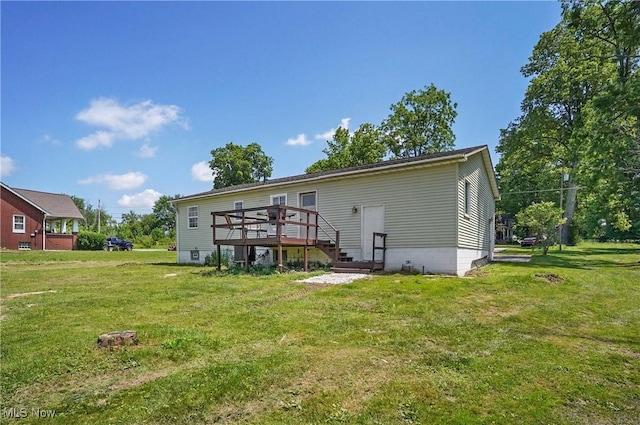 13774 Smith Goshen Rd, Beloit, OH 44609 - rear view of house with a deck and a lawn