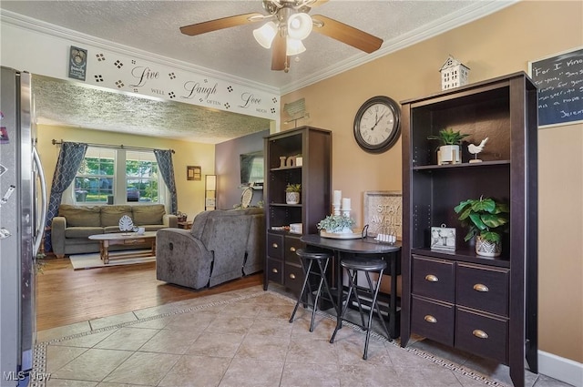 13774 Smith Goshen Rd, Beloit, OH 44609 - living area with a textured ceiling, ornamental molding, a ceiling fan, and tile patterned flooring