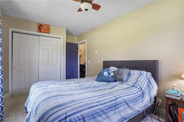 13774 Smith Goshen Rd, Beloit, OH 44609 - carpeted bedroom featuring a closet, a textured ceiling, and ceiling fan